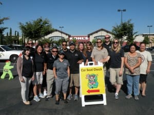 Safe Kids Greater Sacramento Child Passenger Safety Technicians ready to give out booster seats at Kohl's Childspree 2013.